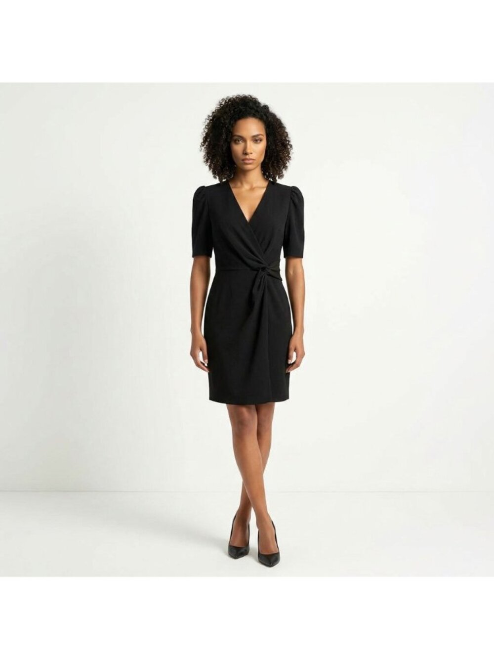 DKNY Little Blaack Dress features a flattering faux-wrap bodice with a chic side
